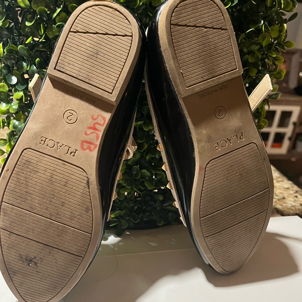 Children place shoes